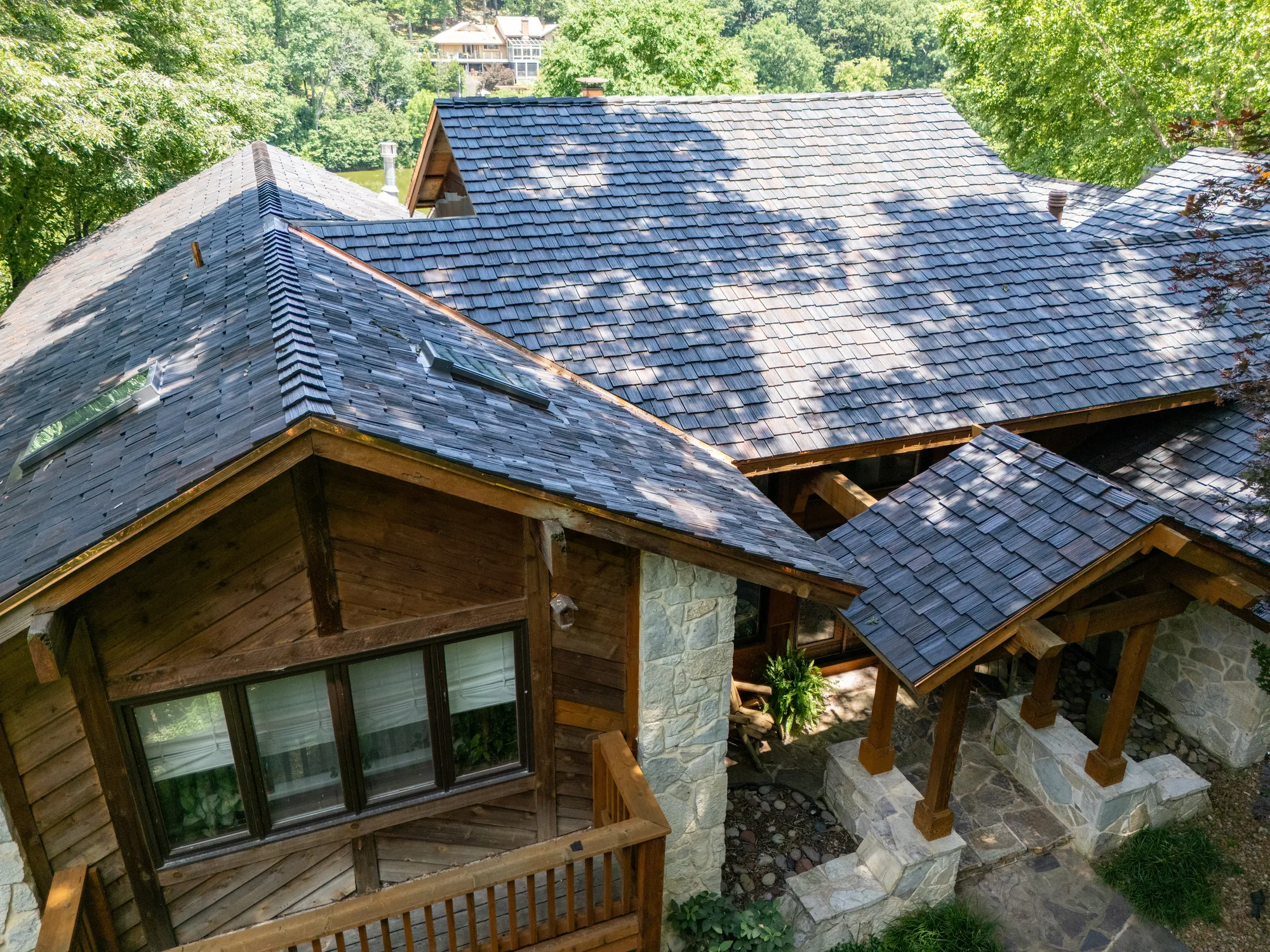 Finished shake roof over the timber balconies of a wooded lodge home