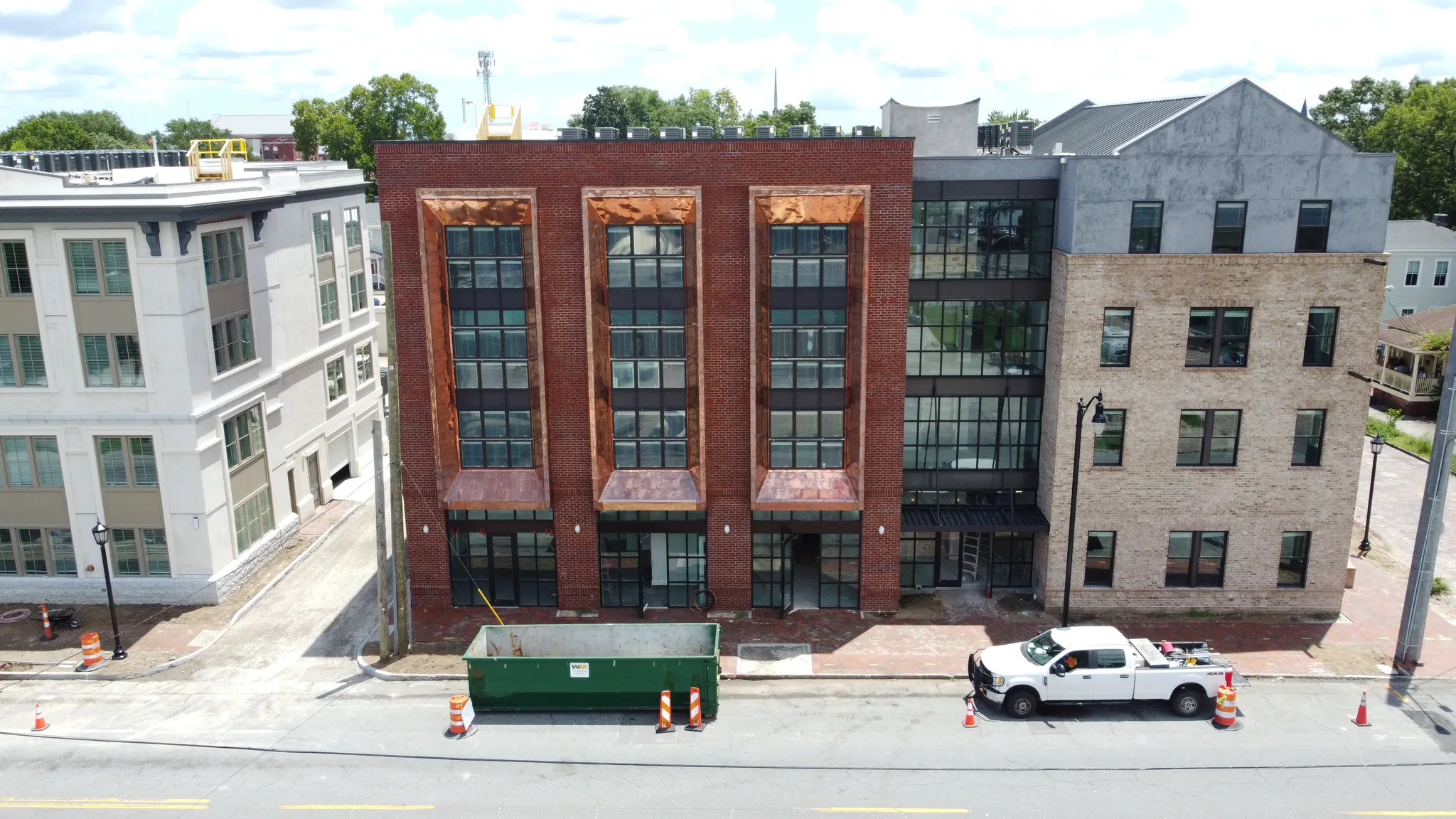 Multi-story office building with copper window detailing and a new roof