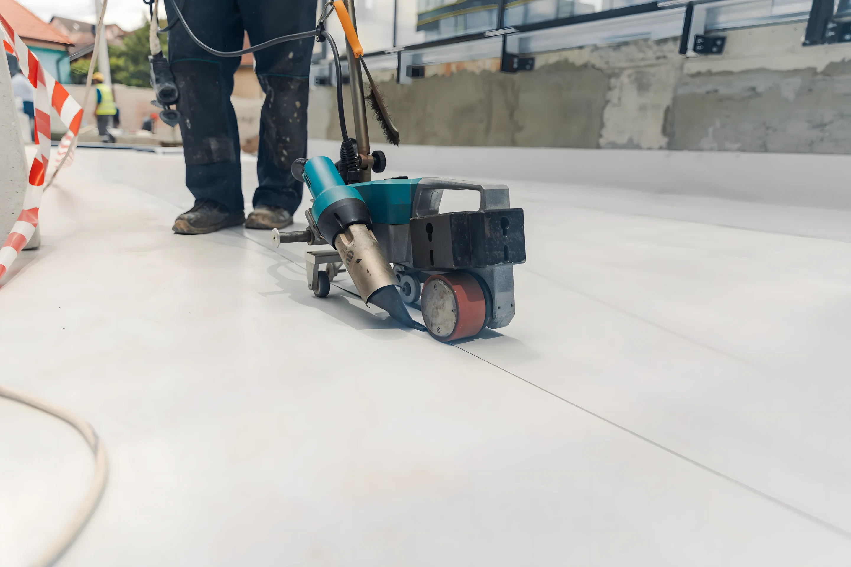 Automated walk-behind seam welder on TPO