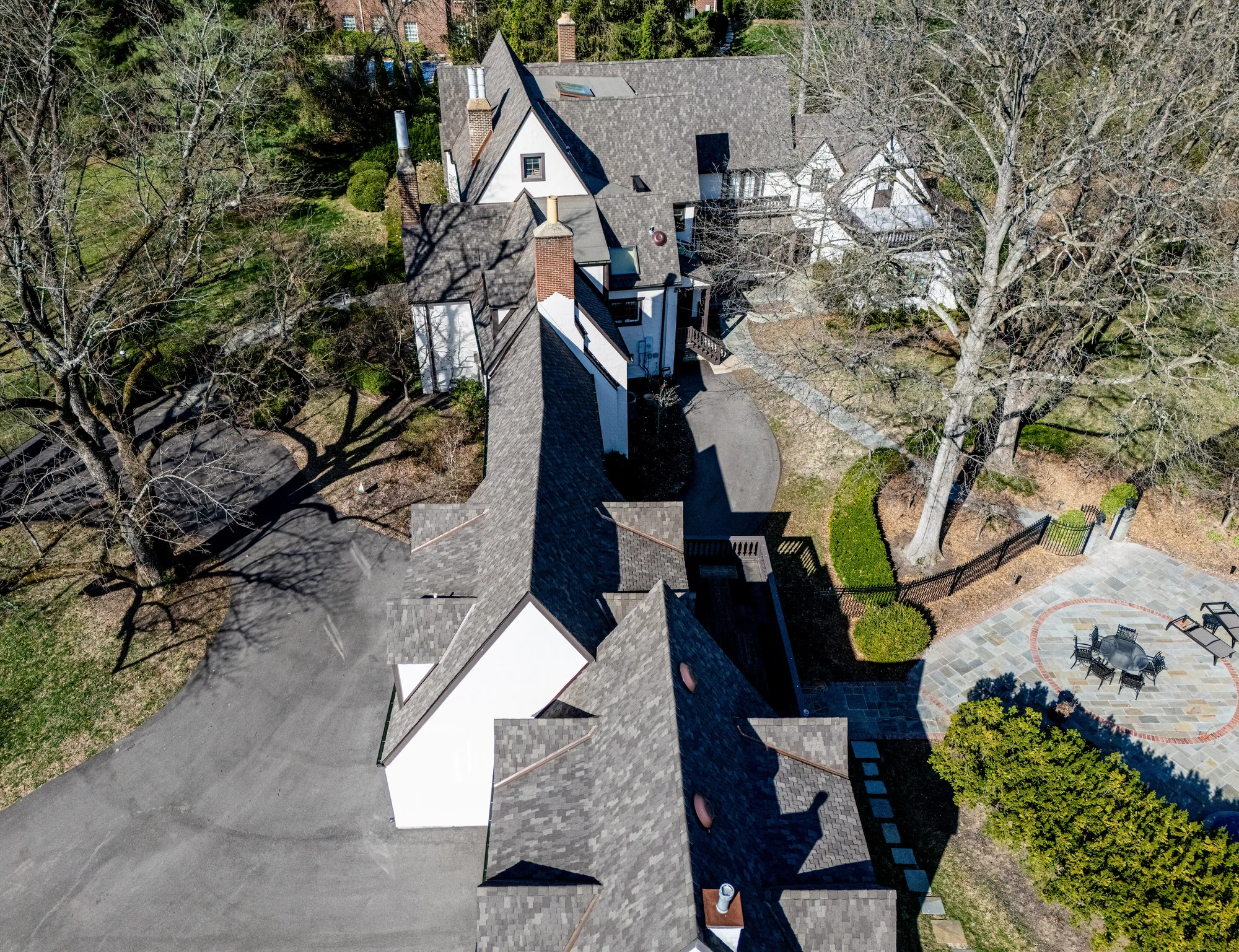 White Tudor estate in Clayton with its finished dimensional shingle roof