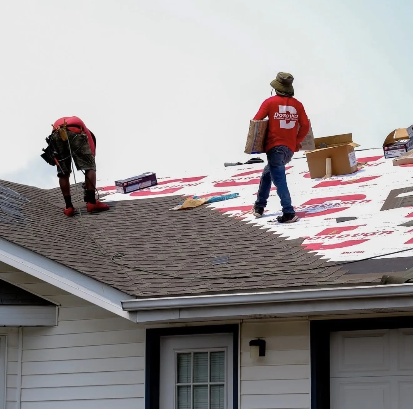 Donovan crew working on a sided home