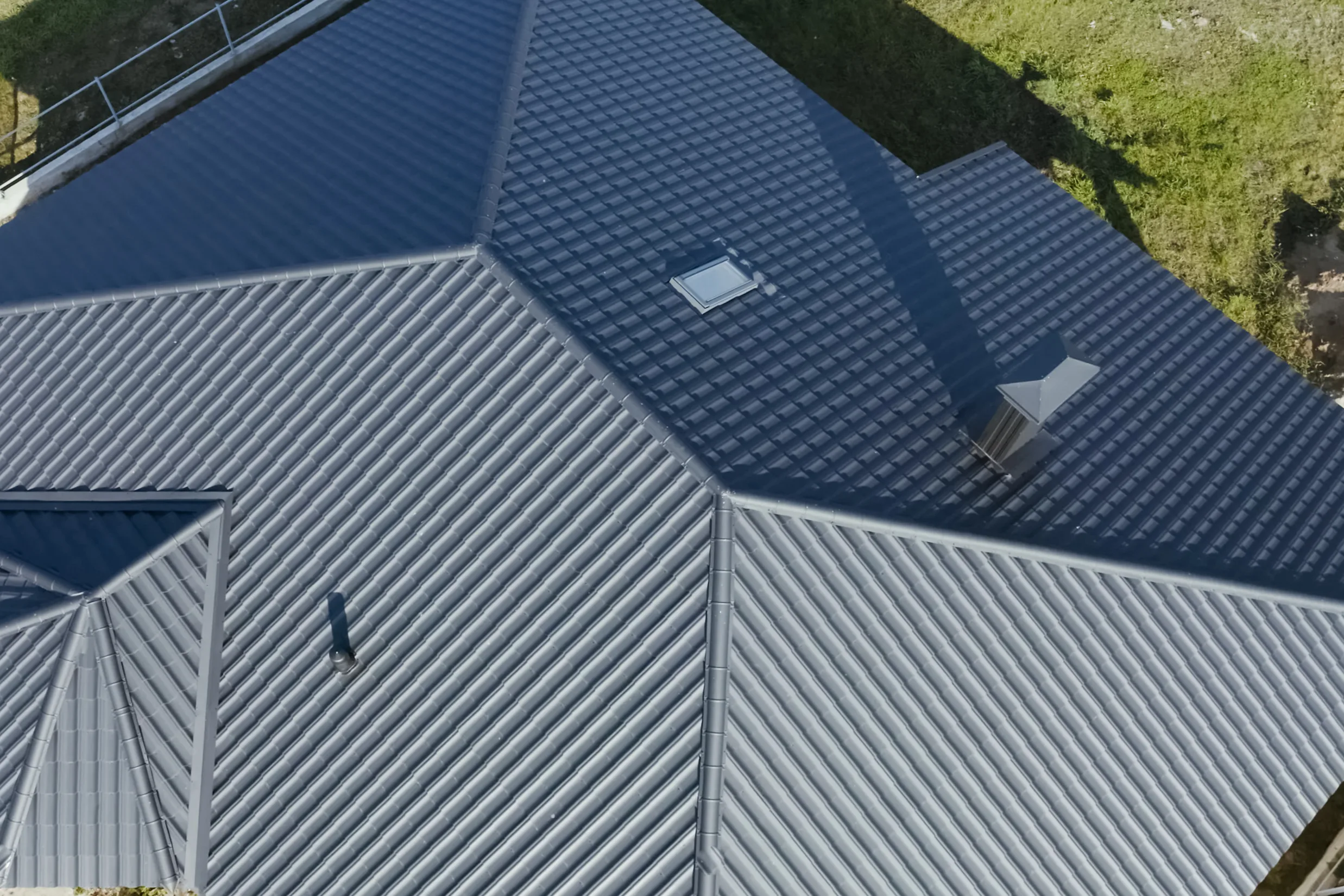Aerial of a finished standing-seam metal roof on a Des Peres executive home