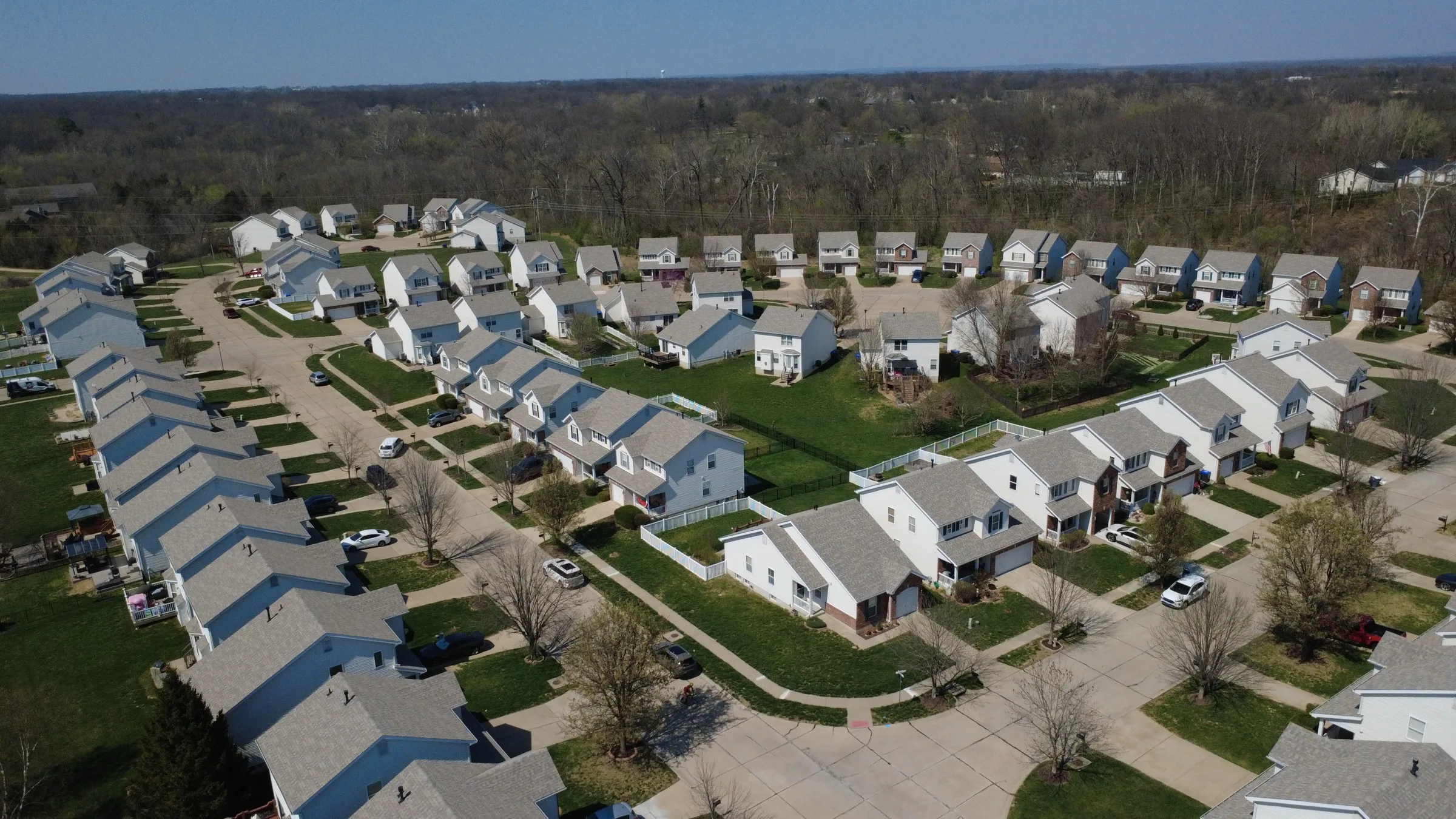 Aerial of the Hyland Green subdivision with matching new shingle roofs on every street
