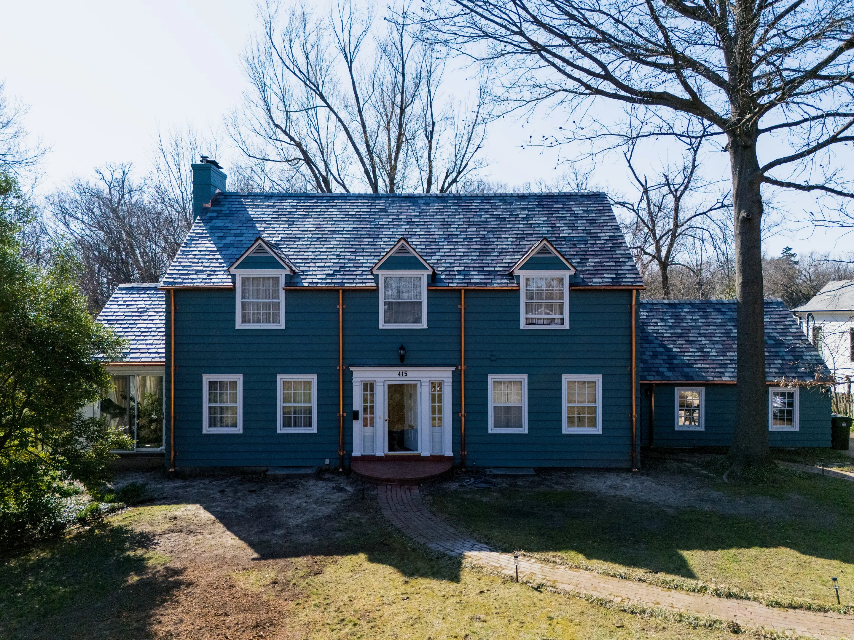 Completed slate roof on a steep-slope building