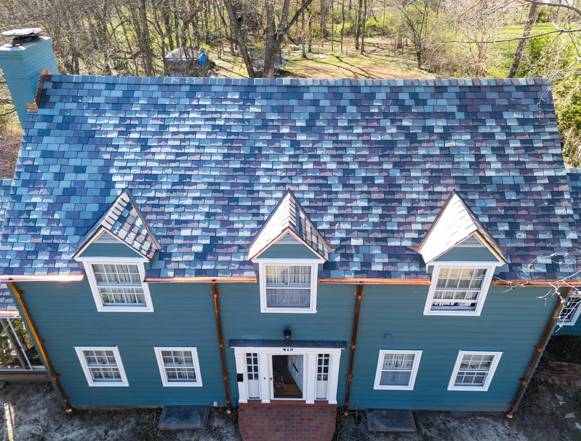 Finished variegated slate slope with dormers on a St. Louis colonial