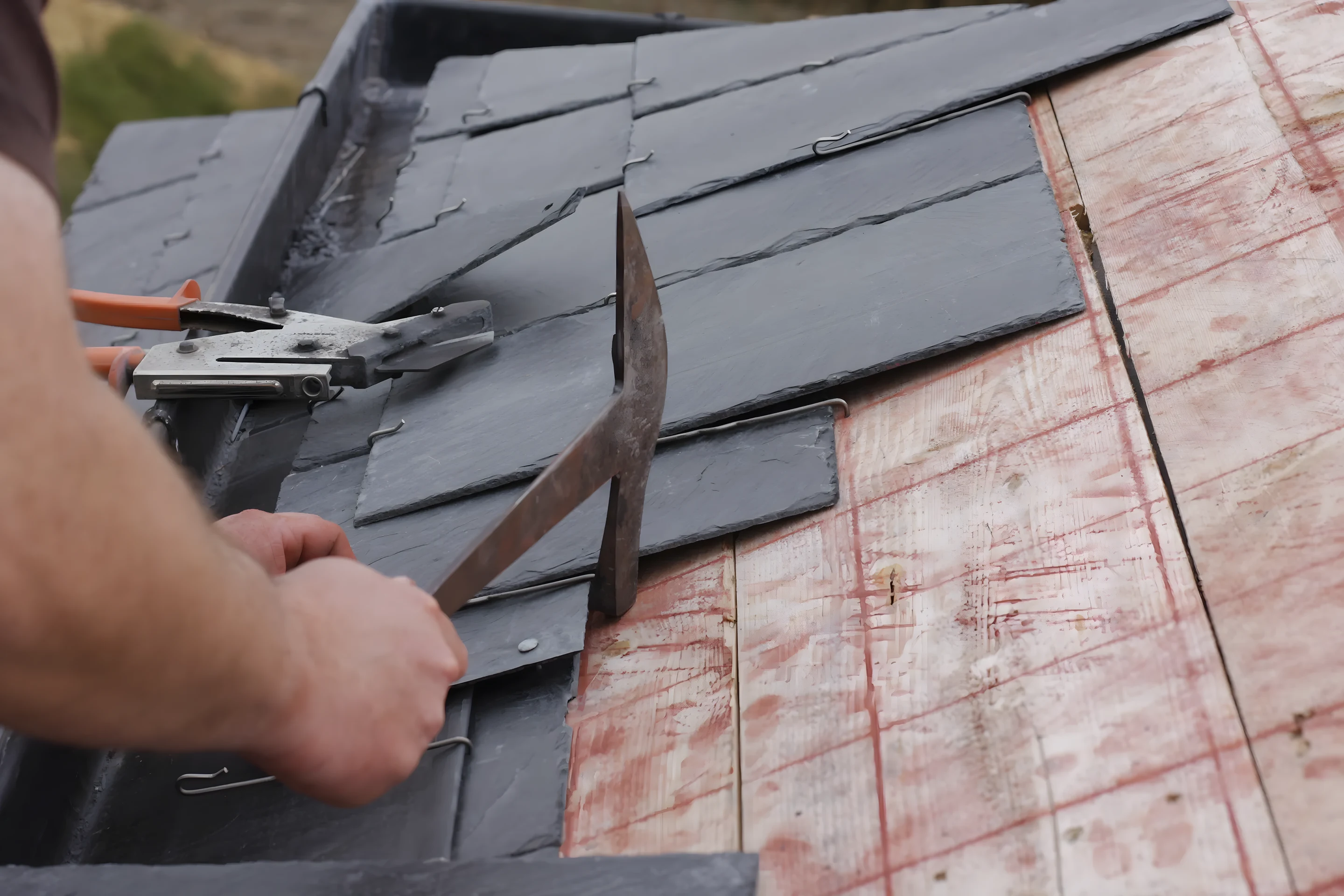 Slating hammer with copper nails and red felt