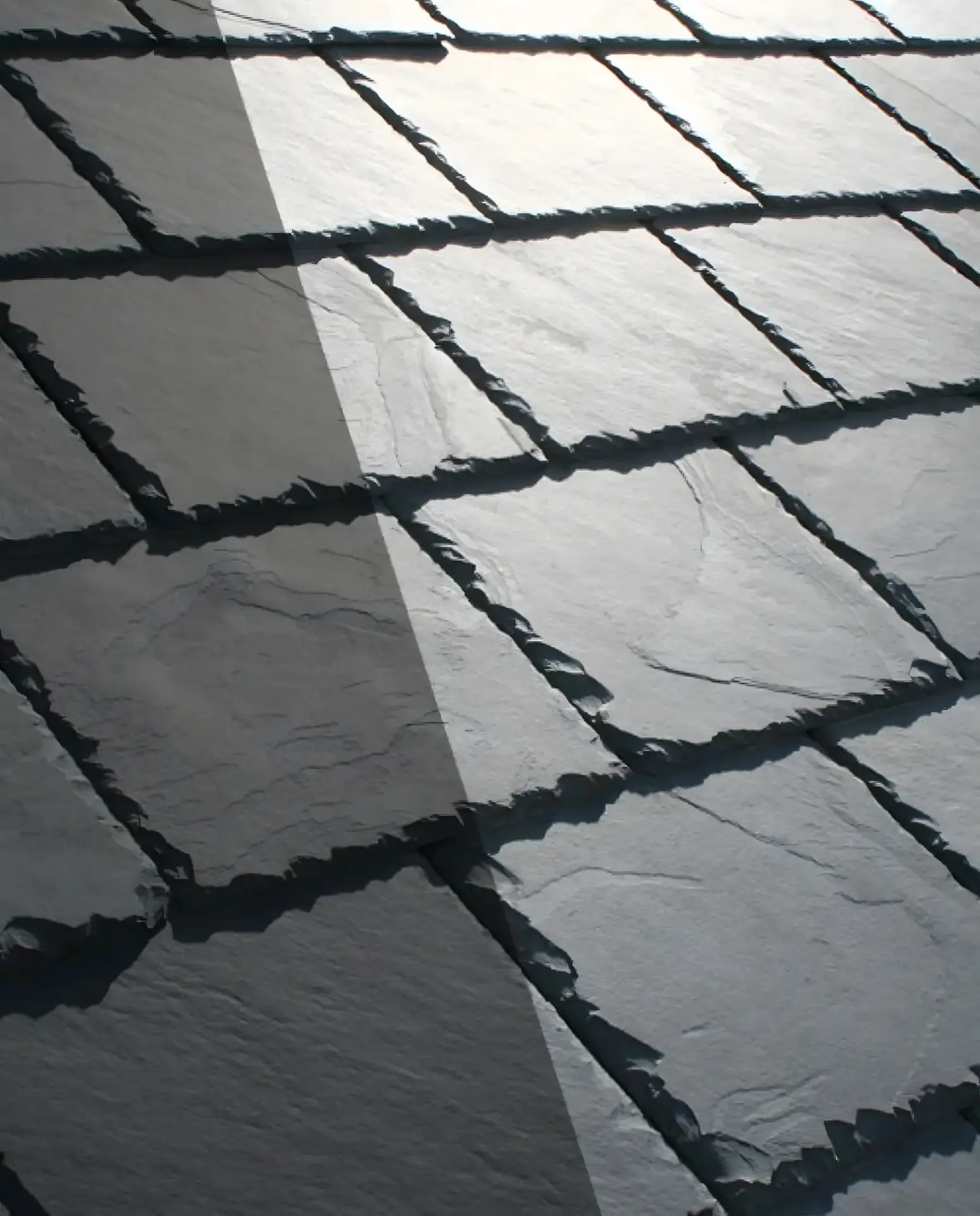 Close-up of a hand-laid slate roof course, the steep-slate work Soulard row houses call for