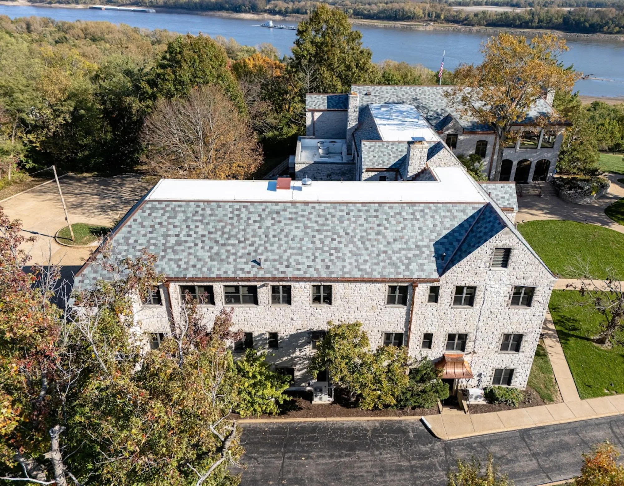 Slate-roofed estate above a river bluff