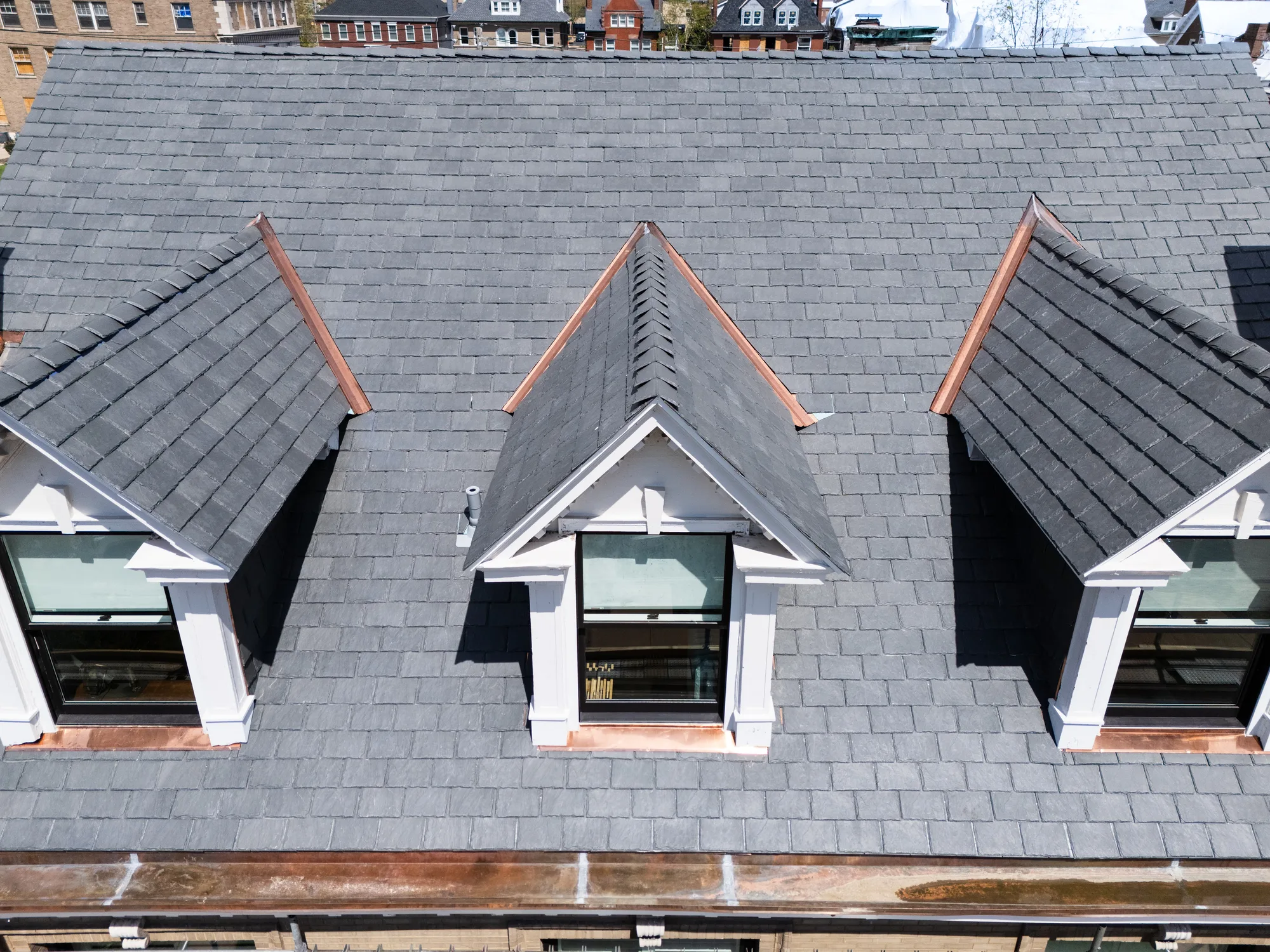 New slate field and three dormers over a copper-topped bay on a Westminster Place home