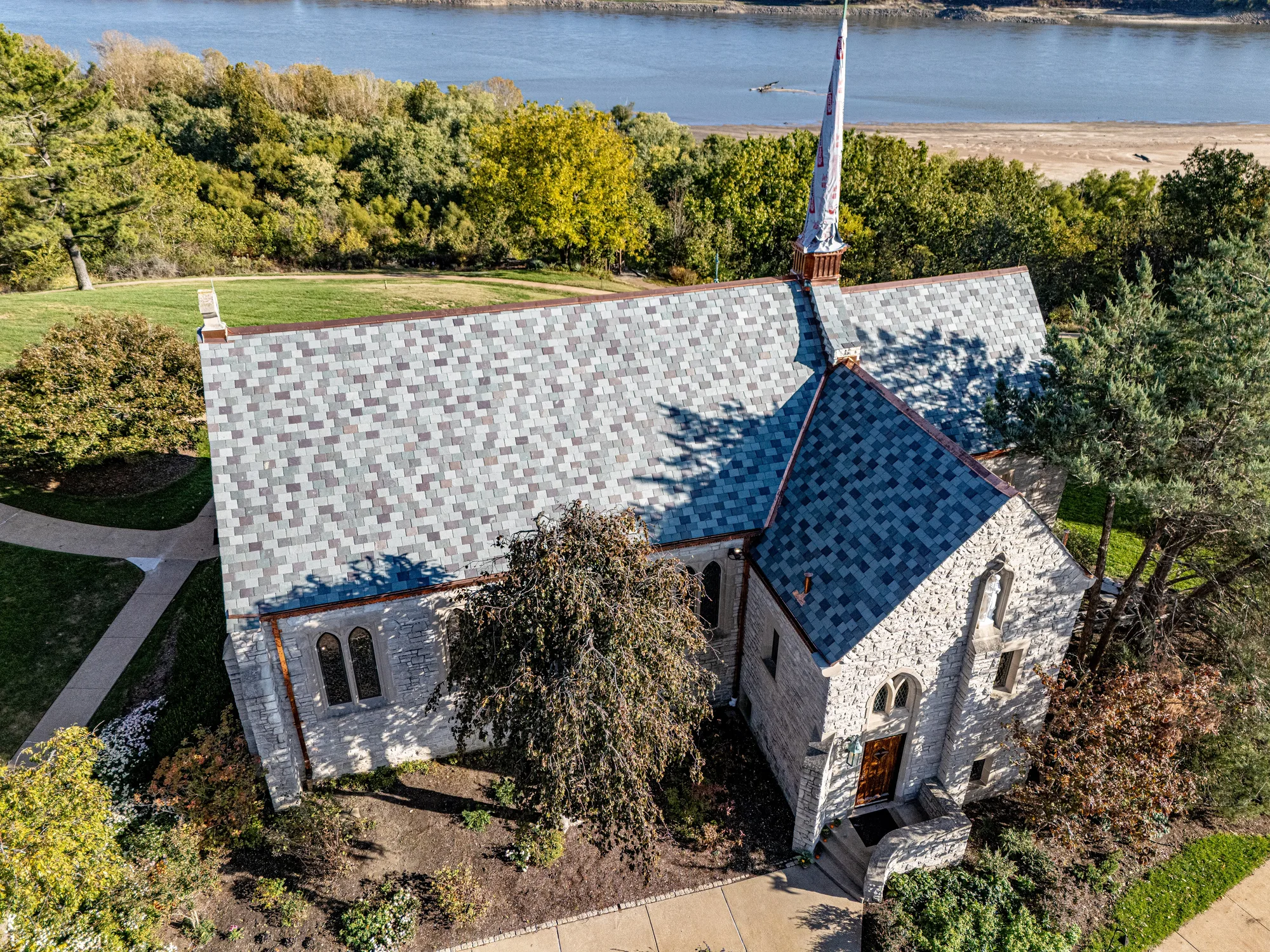 The White House Retreat chapel and its new variegated slate roof above the Mississippi River