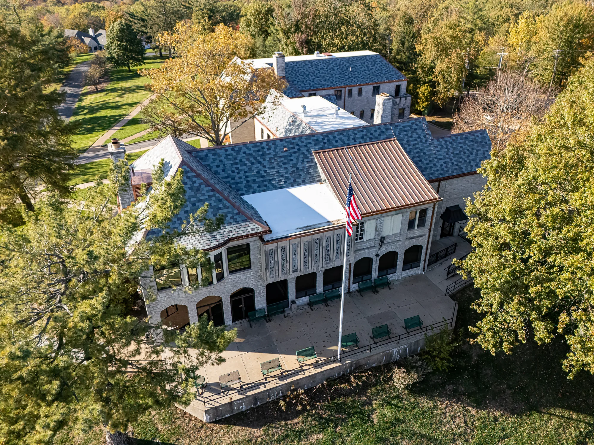 The retreat's manor building and its slate roof in autumn